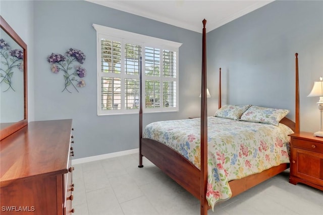 bedroom featuring baseboards and crown molding