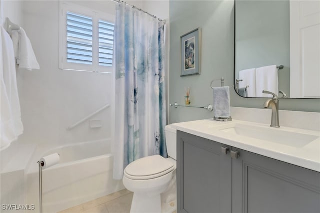 bathroom with shower / tub combo with curtain, vanity, toilet, and tile patterned floors