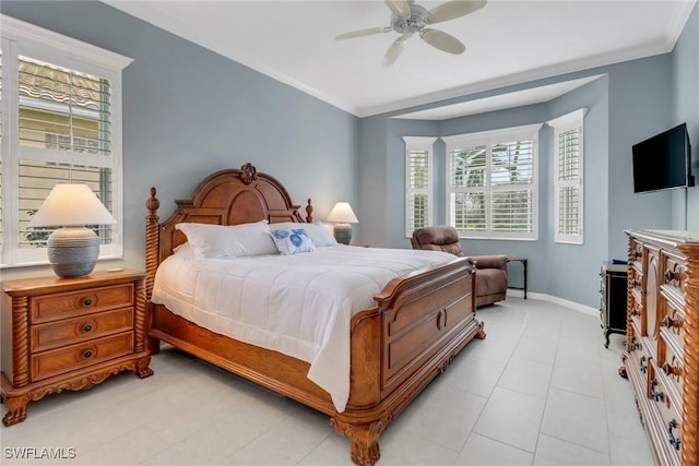 bedroom with a ceiling fan, baseboards, and crown molding