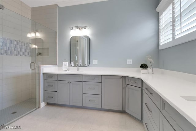 bathroom with a stall shower and vanity