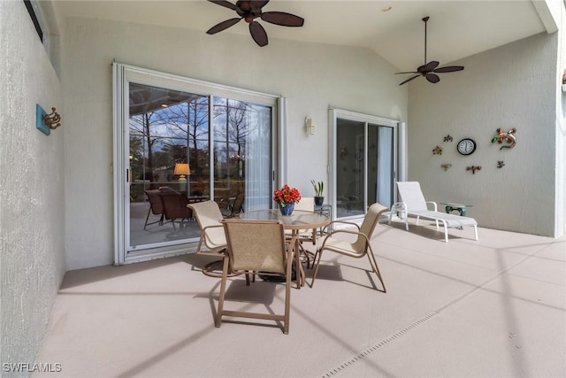 view of patio with a ceiling fan and outdoor dining area