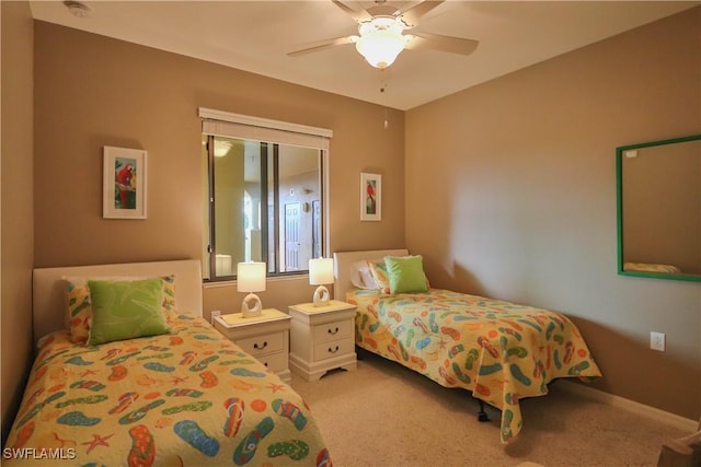 bedroom with ceiling fan and light carpet