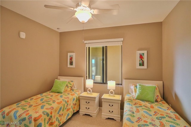 bedroom featuring light carpet and ceiling fan