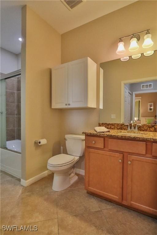 full bathroom featuring toilet, tile patterned floors, shower / bath combination with glass door, and vanity