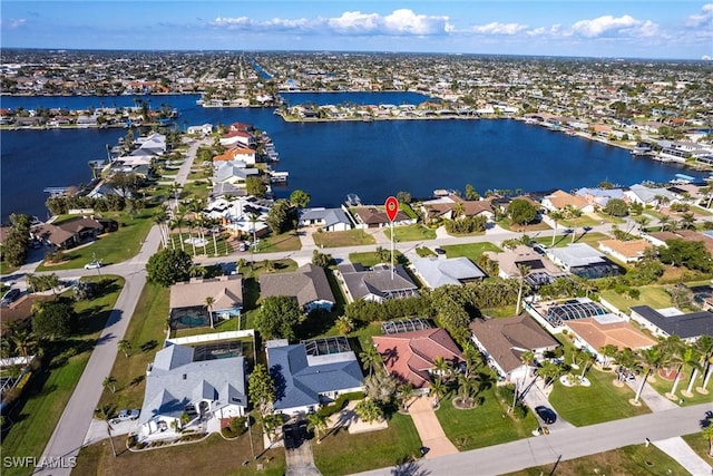 aerial view with a residential view and a water view