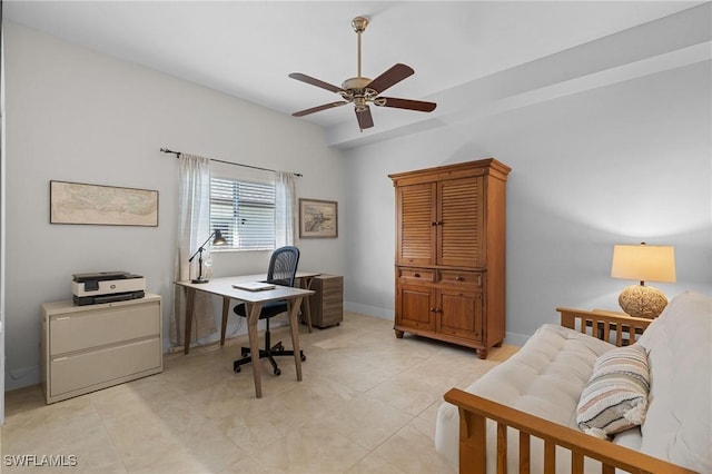 office with a ceiling fan, light tile patterned flooring, and baseboards