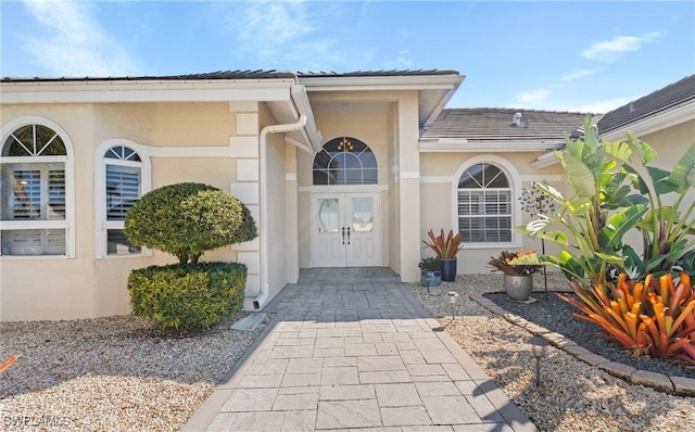 522 SW 51st Ter, Cape Coral, FL 33914 - entrance to property featuring stucco siding and a tile roof