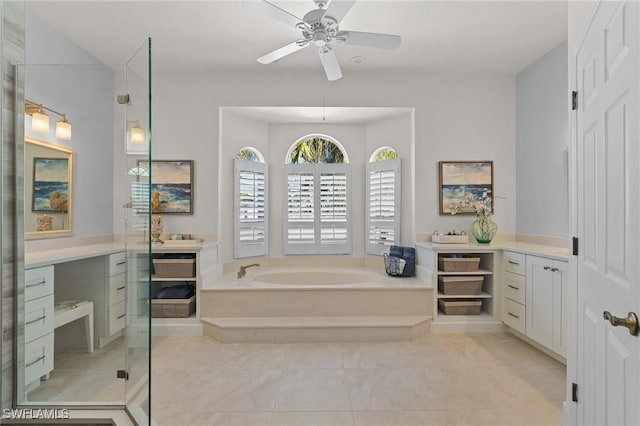 bathroom featuring a ceiling fan, vanity, a shower stall, and a bath