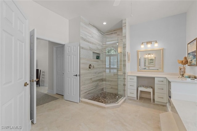 full bathroom with tile patterned floors, vanity, and a walk in shower