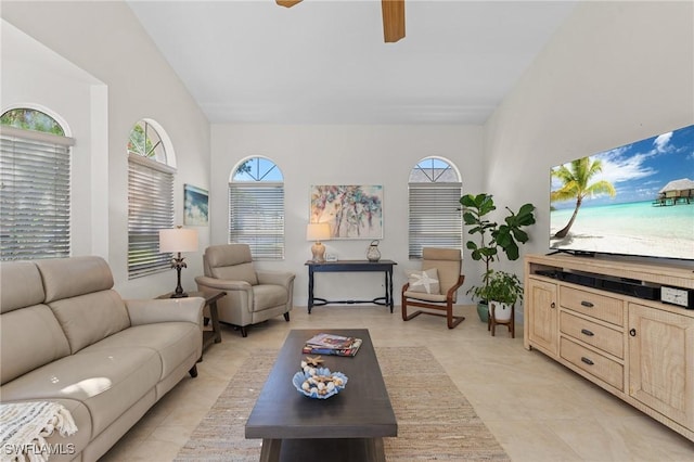 living room with light tile patterned floors and a ceiling fan