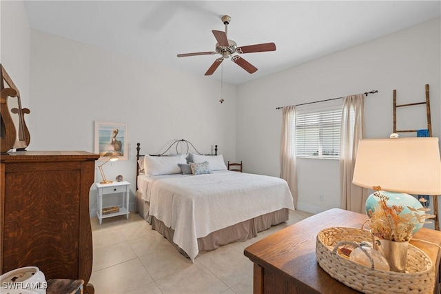 bedroom with a ceiling fan and light tile patterned floors