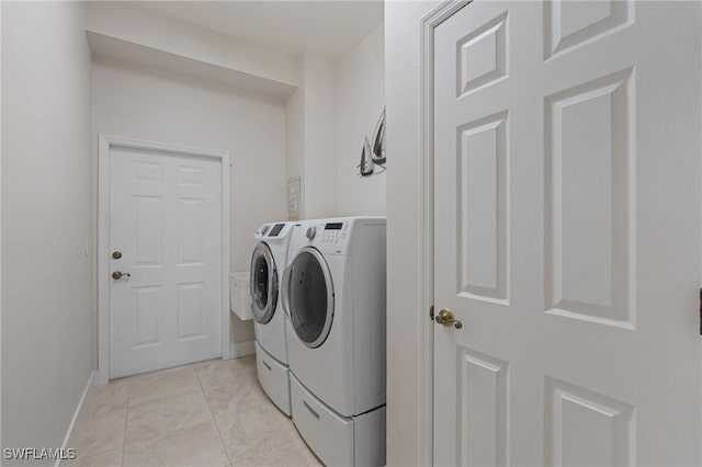 522 SW 51st Ter, Cape Coral, FL 33914 - laundry area with laundry area, washing machine and dryer, and baseboards