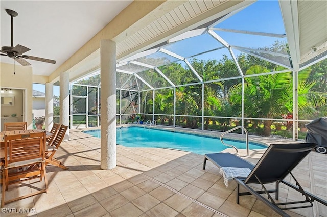 pool with ceiling fan, a patio area, and a lanai