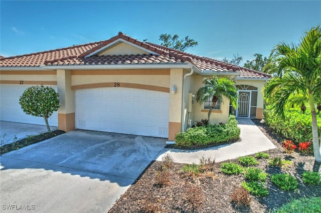 mediterranean / spanish-style home featuring a garage