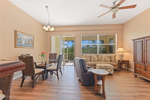 living room with hardwood / wood-style flooring and ceiling fan