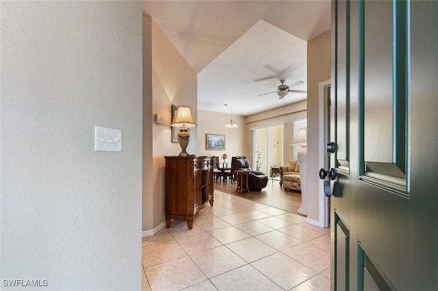 tiled foyer with ceiling fan