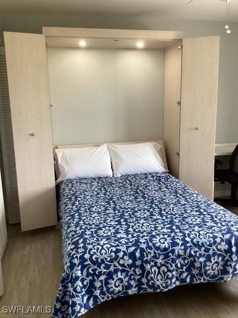 bedroom with wood-type flooring