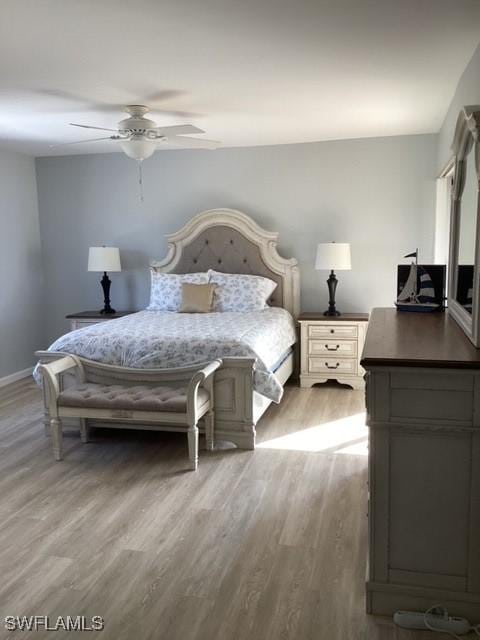 bedroom featuring hardwood / wood-style flooring and ceiling fan