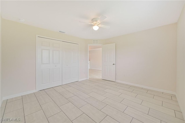 unfurnished bedroom with a closet and ceiling fan