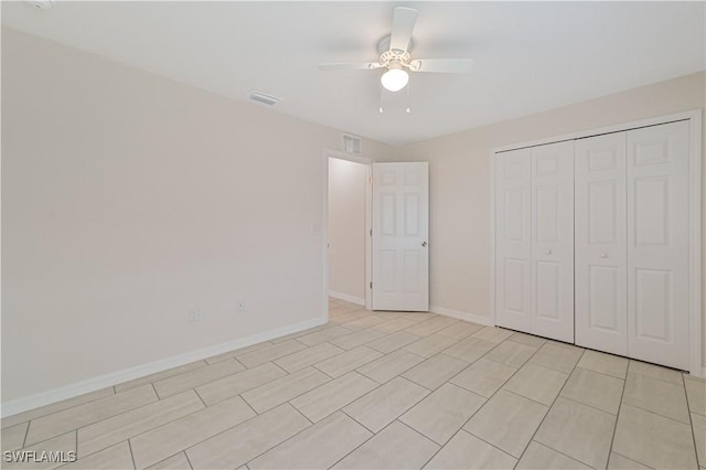 unfurnished bedroom with a closet and ceiling fan