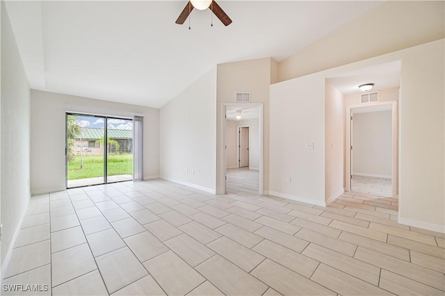 spare room featuring ceiling fan and vaulted ceiling