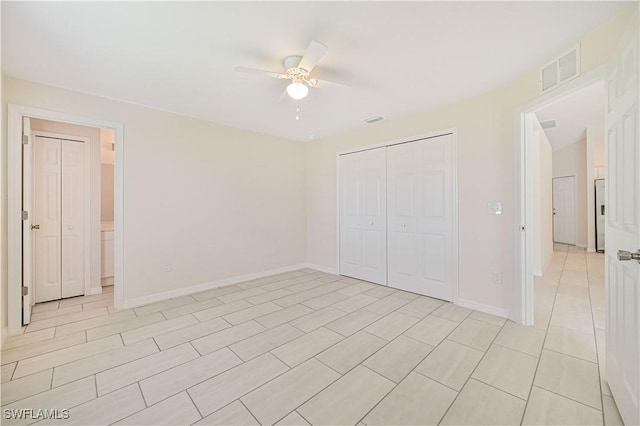 unfurnished bedroom with a closet and ceiling fan