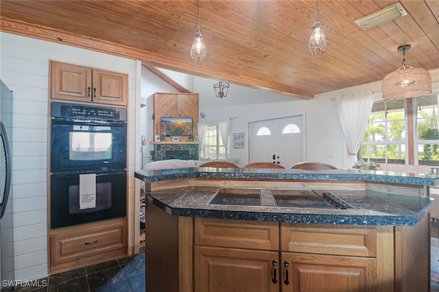 kitchen featuring lofted ceiling, black appliances, a fireplace, hanging light fixtures, and wood ceiling