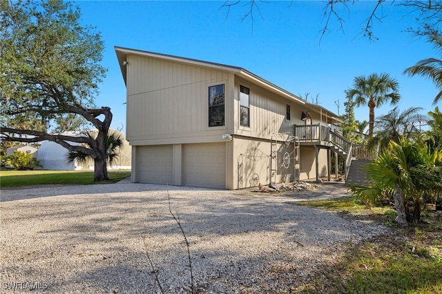 view of side of home featuring a garage