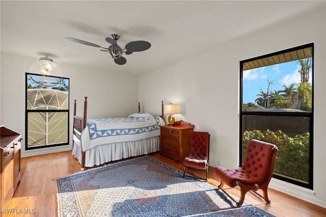 bedroom with ceiling fan and wood-type flooring