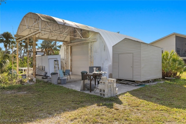 view of outdoor structure with a lawn