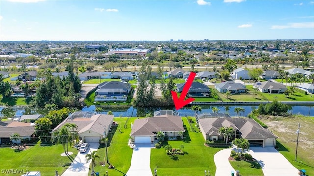 bird's eye view with a residential view and a water view