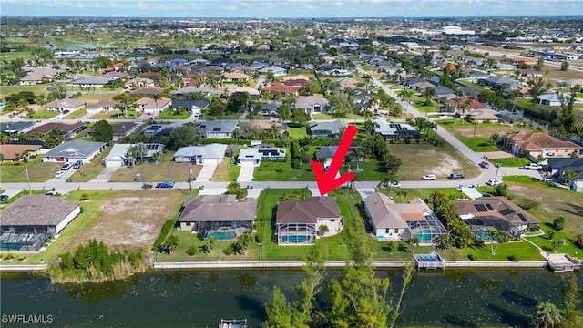 bird's eye view with a water view and a residential view