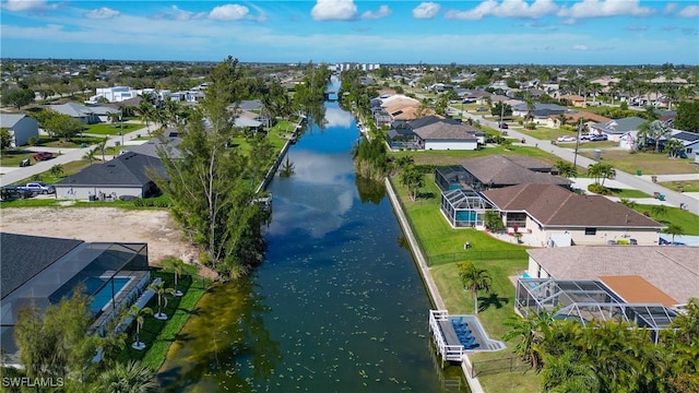 bird's eye view featuring a water view and a residential view