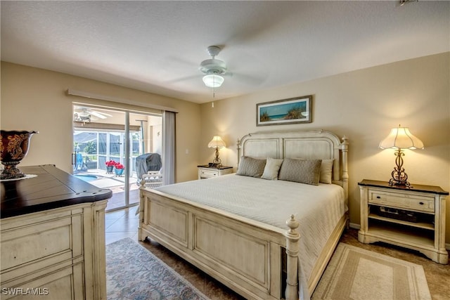 tiled bedroom with access to outside and ceiling fan