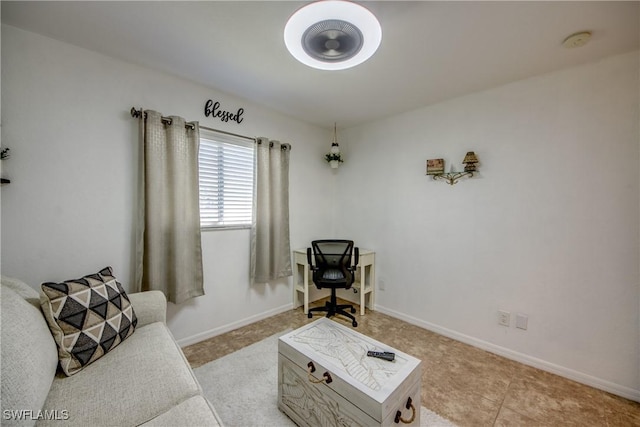 living area with light tile patterned floors and baseboards