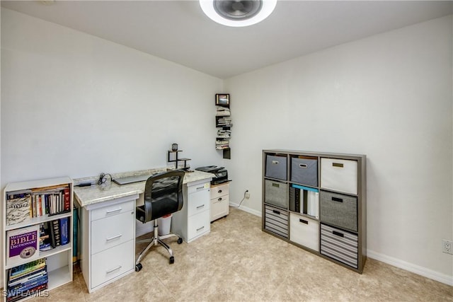 office area featuring baseboards