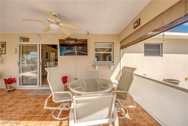 view of patio / terrace with a ceiling fan and outdoor dining space