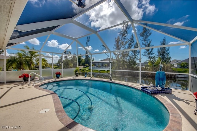 pool with a patio area and a lanai