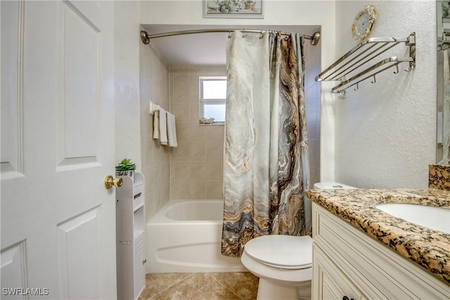 bathroom featuring shower / bath combo, tile patterned flooring, vanity, and toilet