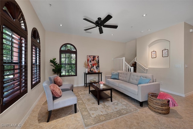 living area featuring recessed lighting, visible vents, baseboards, and stairs