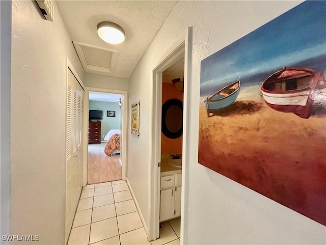 hallway featuring light tile patterned flooring