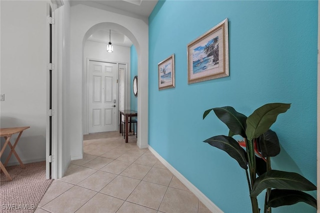 hall with light tile patterned flooring