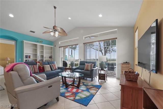 tiled living room featuring lofted ceiling and ceiling fan