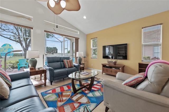 living room with ceiling fan, light tile patterned floors, and high vaulted ceiling