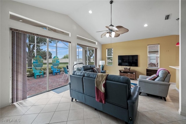 living room with high vaulted ceiling, light tile patterned floors, and ceiling fan