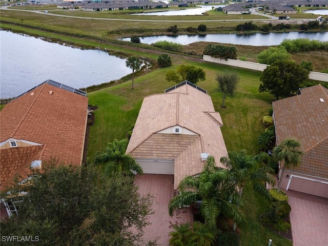 birds eye view of property with a water view