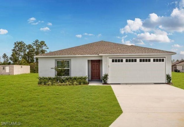 view of front of house with a garage and a front yard