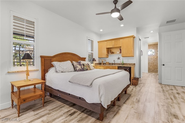 15791 Quail Trl, Bokeelia, FL 33922 - bedroom featuring light wood finished floors, multiple windows, visible vents, and recessed lighting