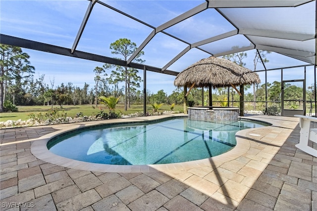 15791 Quail Trl, Bokeelia, FL 33922 - view of swimming pool with a lanai, a patio area, and a pool with connected hot tub