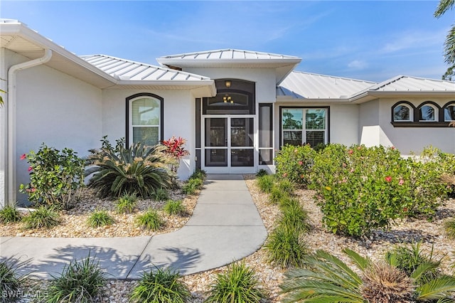 15791 Quail Trl, Bokeelia, FL 33922 - doorway to property featuring stucco siding